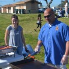 Kings Lions's member Joe Arruda keeps an eye on the hot dogs.